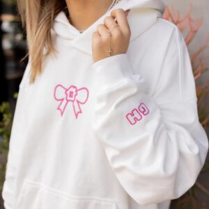 A loose printed hooded top with trendy unisex prints and fresh bow prints hoodies